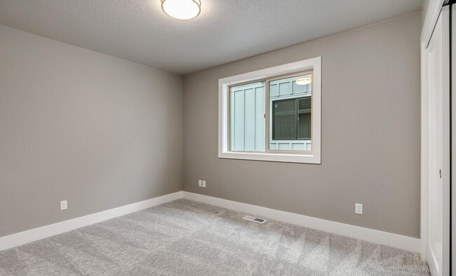 Building Photo - Bethany Stunner - 5 Bedrooms with Main-Level Bed & Bath, Modern Kitchen & Private Fenced Yard