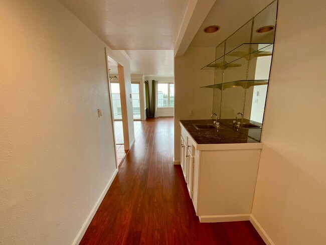 Building Photo - 1,300+ Sq Ft 2BR Condo w/ Parking, W/D & Utilities Included | $1,000 Move-In Credit