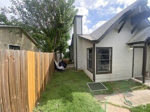 Building Photo - Large 2/2 duplex with a 2 car carport