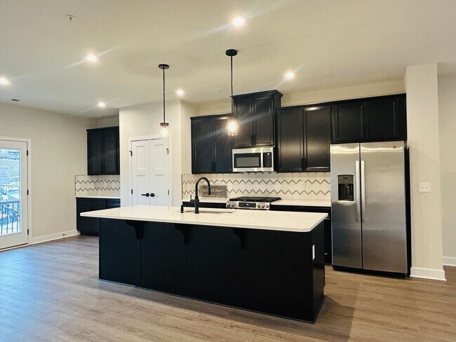 Building Photo - New Construction • 4 BR • 2 Full / 2 Half BA • End Unit Townhome in Village Town – Fayetteville’s...