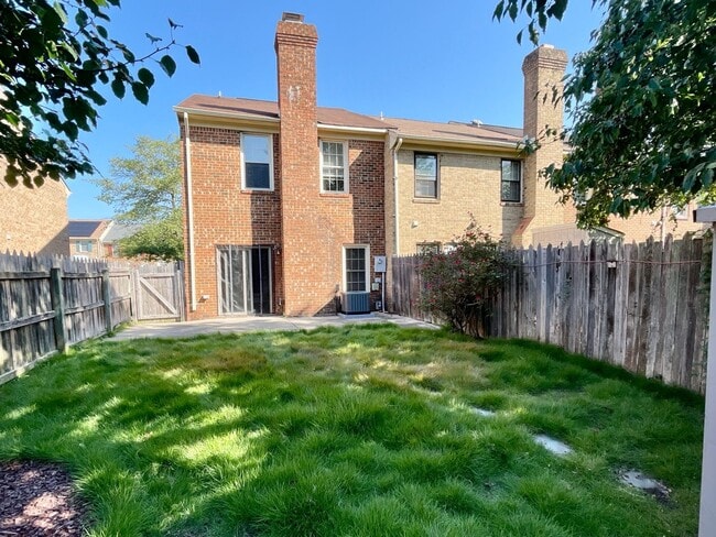 Building Photo - Updated End-Unit Brick Townhome Ready NOW!...