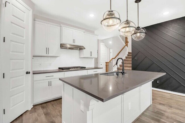 Building Photo - ASK ABOUT FREE APPLICATIONS THROUGH AUGUST!  "Spacious 4-Bedroom Sanctuary with Cozy Fireplace in...