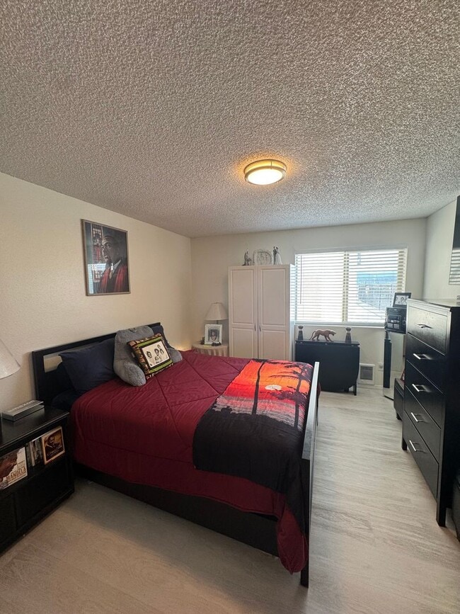 Building Photo - Gorgeous Condo in Seward Park with 2 Parking Spaces, Steps Away from Pool with Water View!