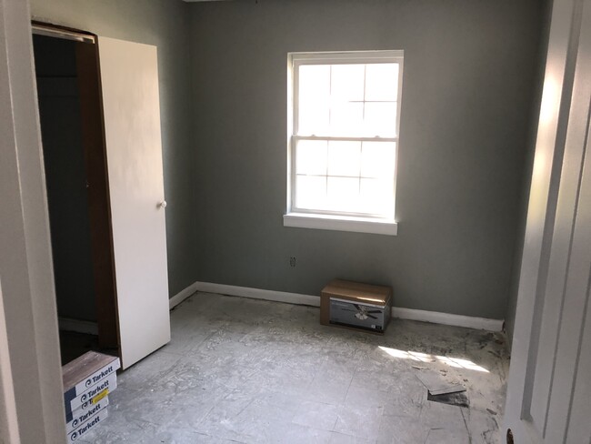 bedroom 1 ready for the new flooring and a little bit of frame work - 208 W Easy St