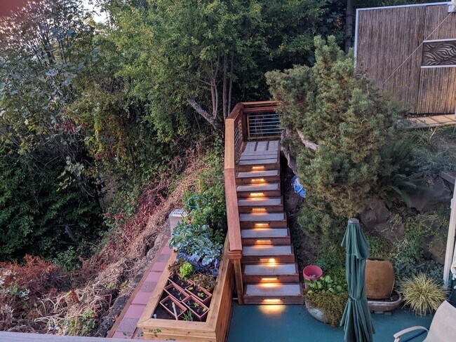 At dusk, each stair is lit and other lights come on automatically from street to Apartment door. - 8261 Northrop Plz SW