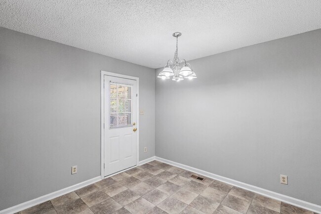 Building Photo - NE Home - Updated Kitchen and Bathrooms!  SS Appliances, Fire Place, Front Porch & Deck, Fenced Y...