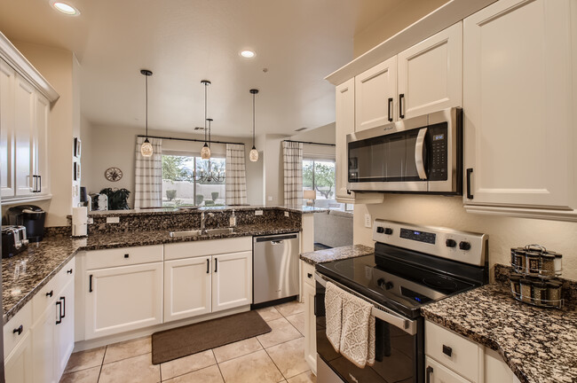 Kitchen view with newer stainless steel appliances - 19475 N Grayhawk Dr