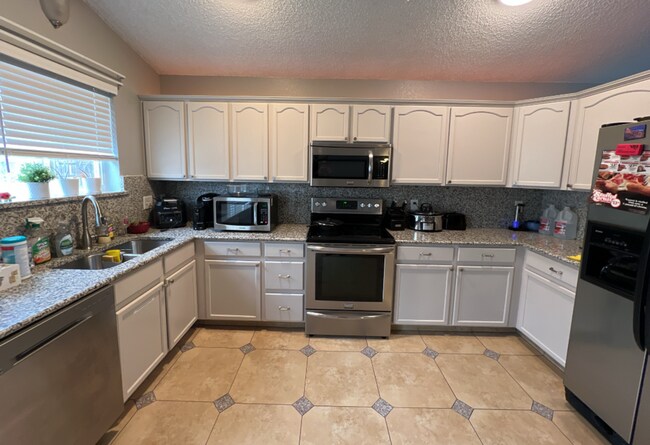 Building Photo - Beautifully Remodeled 5-Bedroom Home with Finished Basement and Custom Upgrades!