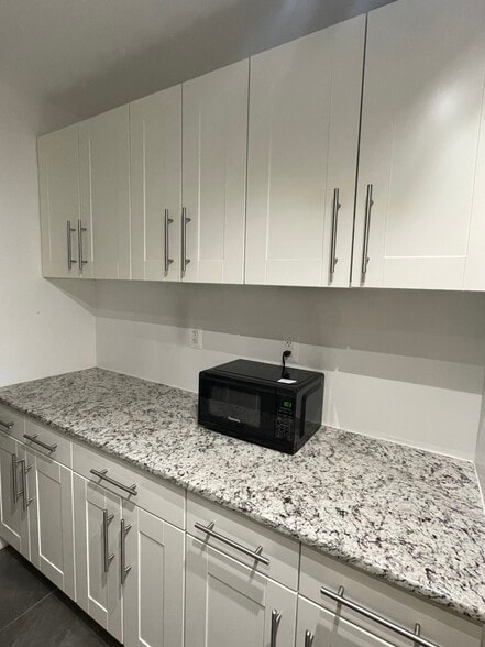 Kitchen shelves and microwave - 4201 Cathedral Ave NW