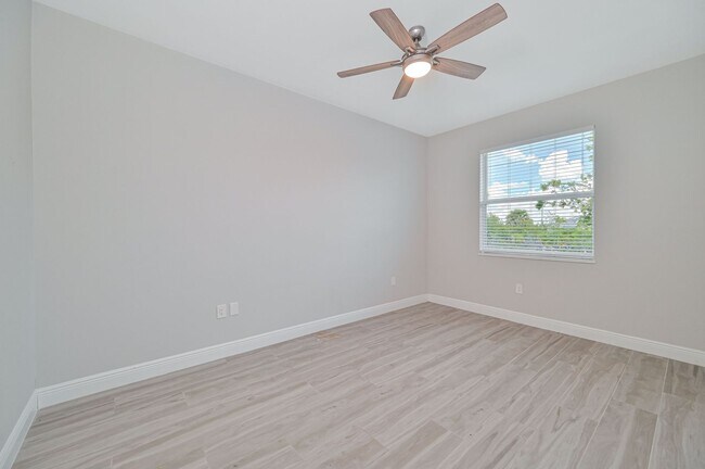 Building Photo - NOW AVAILABLE - Gorgeous Pool Home ~ NW Cape ~ 3 Car Garage ~ On Canal!