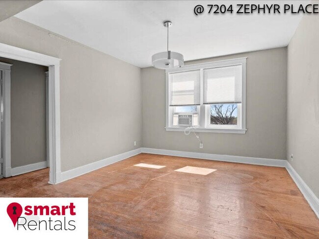 Building Photo - 7204 Zephyr Place - 2E