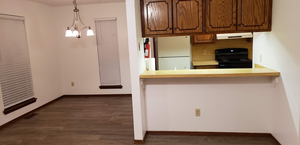 View of Bar with storage overhead - 908 Acacia Cir