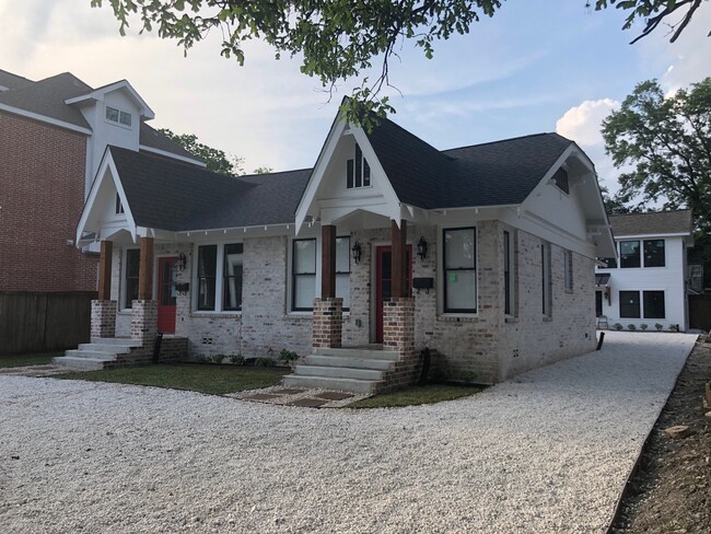 Side view of house showing garage apartments behind house - 1742 W Main St