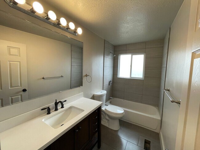 Building Photo - Spacious 6-Bedroom Magna Home with Fenced Yard