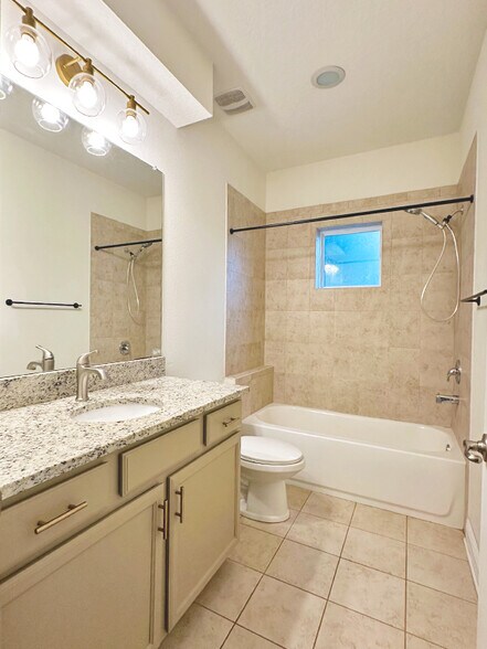 Primary bathroom featuring modern fixtures and functional layout. - 1736 W Walnut St