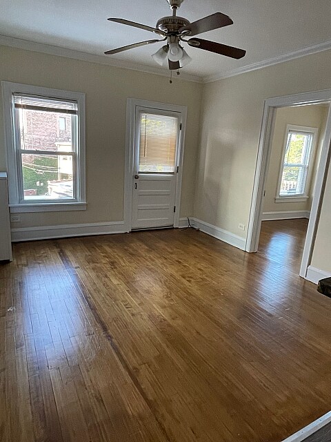 Living room with door to balcony - 805-09 W. Elm St.