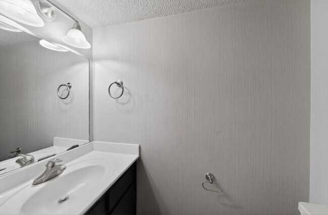 Building Photo - 2-Bed, 1.5-Bath, Two-Level Condo Delivers