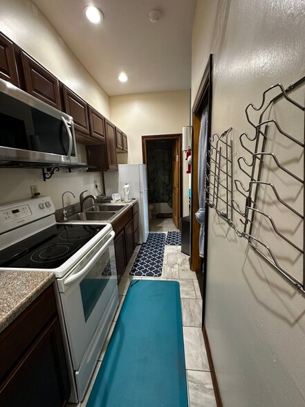 The bedroom is roughly across from stove - 851 9th St