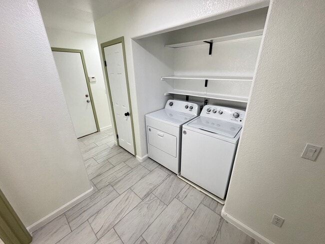 Building Photo - This inviting single-story home boasts a s...