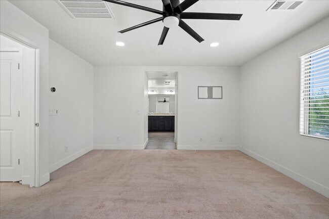 Building Photo - Modern Gated 3 Bedroom Retreat with Loft & Entertainer’s Backyard