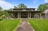 Building Photo - Charming Furnished Estate with Full-Servic...