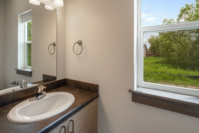 Building Photo - Pet Friendly! Gorgeous 3 Bedroom condo with double stall attached garages with AC.