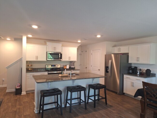 Building Photo - Lovely Four Bedroom Home  Appropriately 5 ...