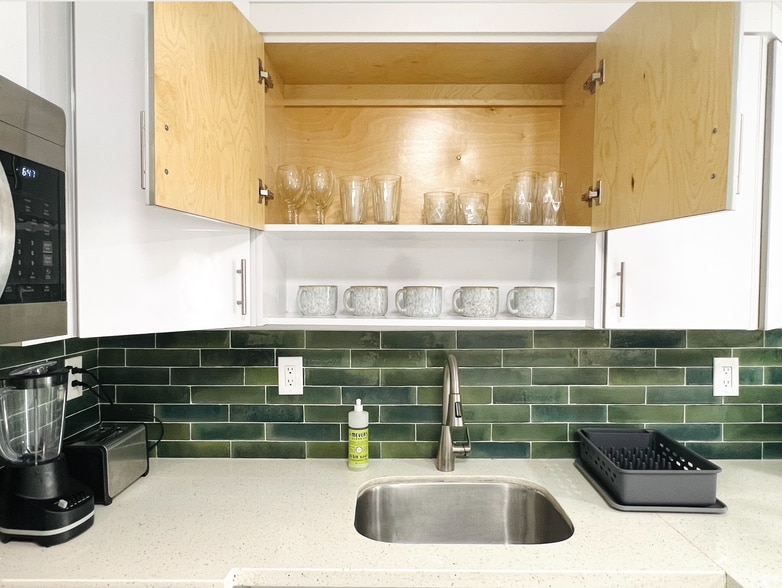 Your favorite coffee or tea mug. And cute glasses for your sunset drink - 6863 NW 2nd Ave