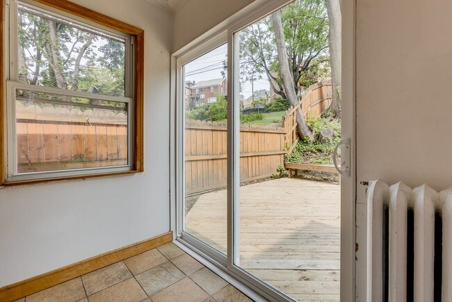 Building Photo - AVAILABLE June 2026 - Beautiful 4 Bedroom, 2 Bath Home w/ Front Porch Swing!