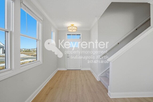 Building Photo - Located in Westfield, IN, this attractive 3-bedroom, 2.5-bath home sits on a corner lot within an...