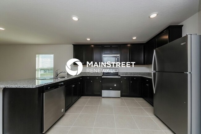 Building Photo - 4 Bedroom Pet-Friendly Home in Mascotte, FL with Main Street Renewal
