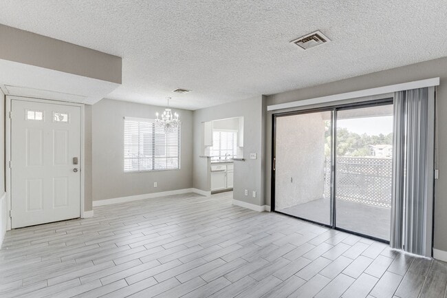 Building Photo - Stylish Upstairs Condo with Dual Primary S...