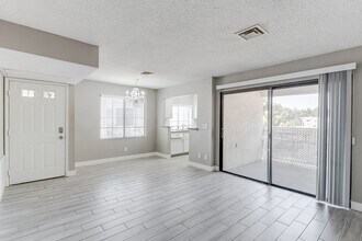 Building Photo - Stylish Upstairs Condo with Dual Primary S...
