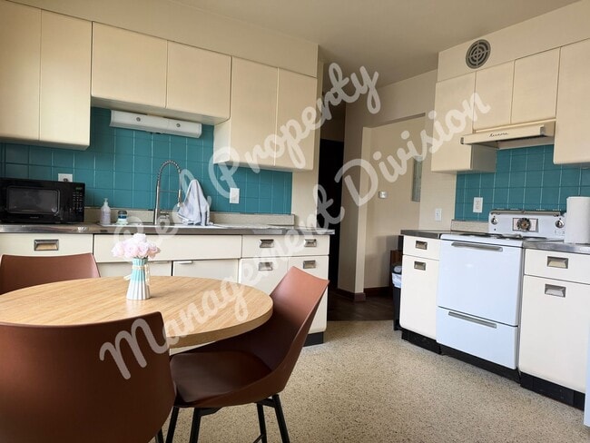 Building Photo - **Charming 2-Bed, 1-Bath Home with Retro Flair + Garage & Yard**