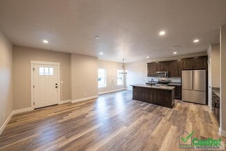 Building Photo - BEAUTIFUL 4 BEDROOM TOWNHOME for rent in Ammon w/ 2 Car Garage! Deposit Free Lease option for qua...