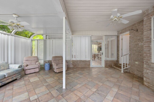 Building Photo - Spacious 3BR Retreat with Soaring Ceilings & Screened Porch