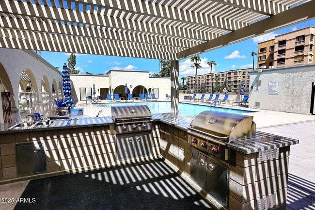 Building Photo - 7910 E Camelback Rd