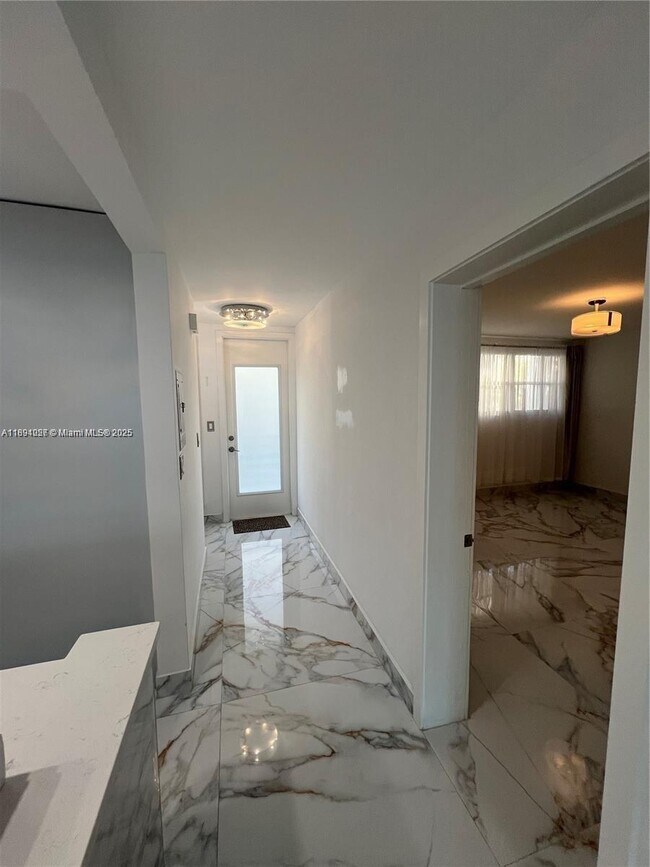 Building Photo - 10240 Collins Ave