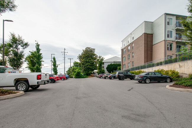 Surface lot assigned parking spot with surveillance and security patrol. - 2407 8th Ave S