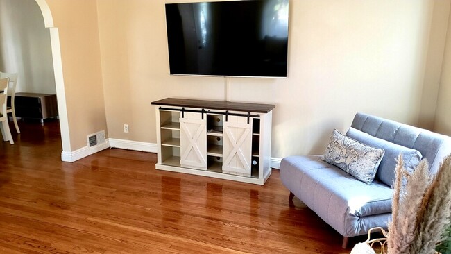 65” TV with sound bar and side board - 1350 Curson S Ave