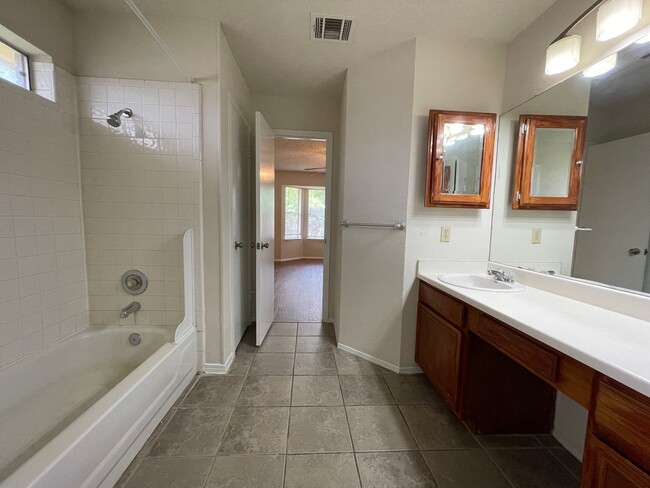 Building Photo - SPACIOUS HOME - NEW FLOORING! - 2 LIVING A...