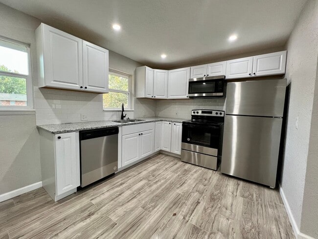 Building Photo - 4817 NW Pollard- COMING SOON!