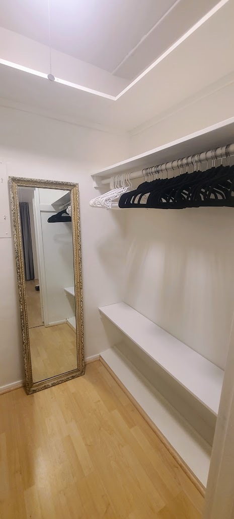 Walk-in closet with full-length mirror. - 3 Island Ave