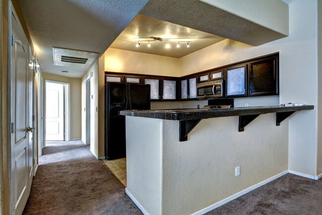 Building Photo - FANTASTIC HIGHLY UPGRADED UNIT FACING THE PARK AND POOL.