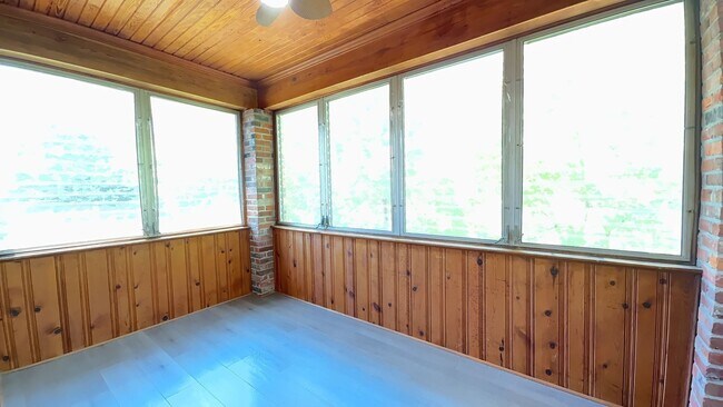 Building Photo - Charming 2BR with Sunroom, Hardwood Floors & Lawn Care Included