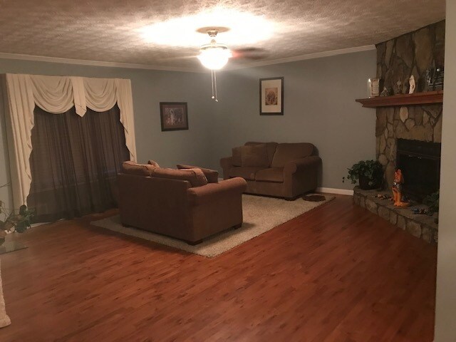 2 loveseats in living room with fireplace - 250 River Trace Ct