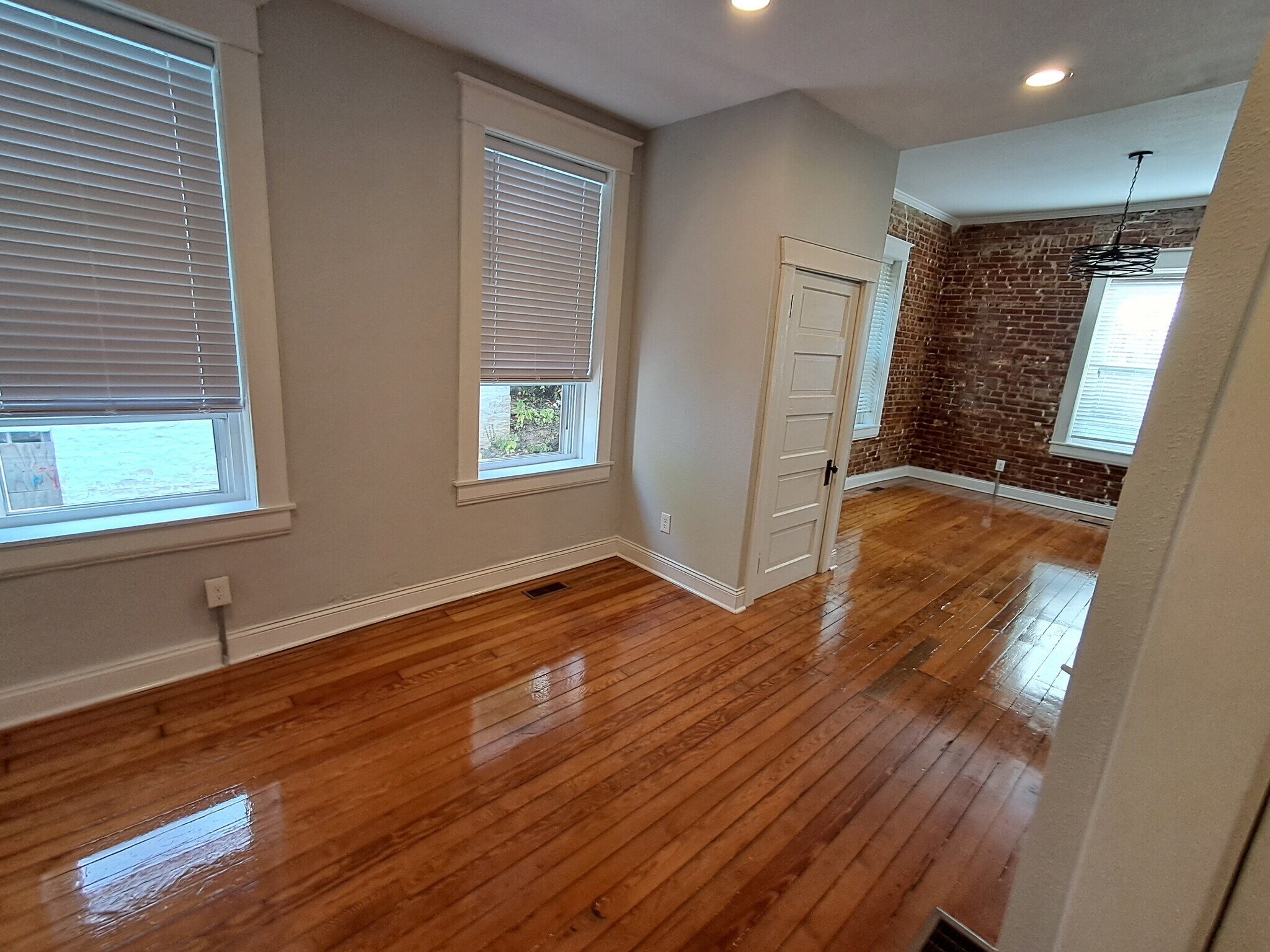 Dining room with front room in background - 1007 E McCarty St
