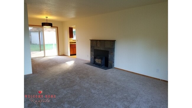 Building Photo - Beautiful Remodeled Rambler!!!  Come enjoy this HUGE backyard!!  NEW CARPET!!