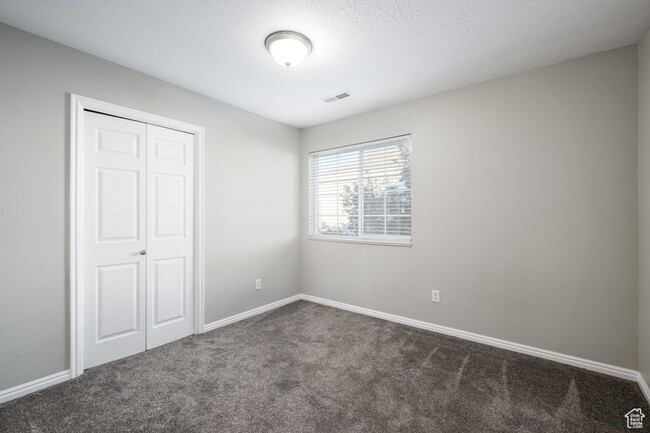 Building Photo - Spacious 3-bedroom top level condo is a mu...