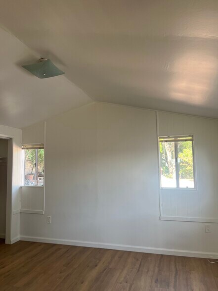 Two bedroom windows that look out onto the side yard - 15138 Encanto Dr